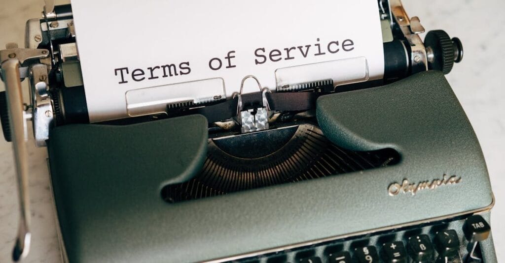 Close-up of a vintage typewriter printing 'Terms of Service' on paper, ideal for legal and business themes.